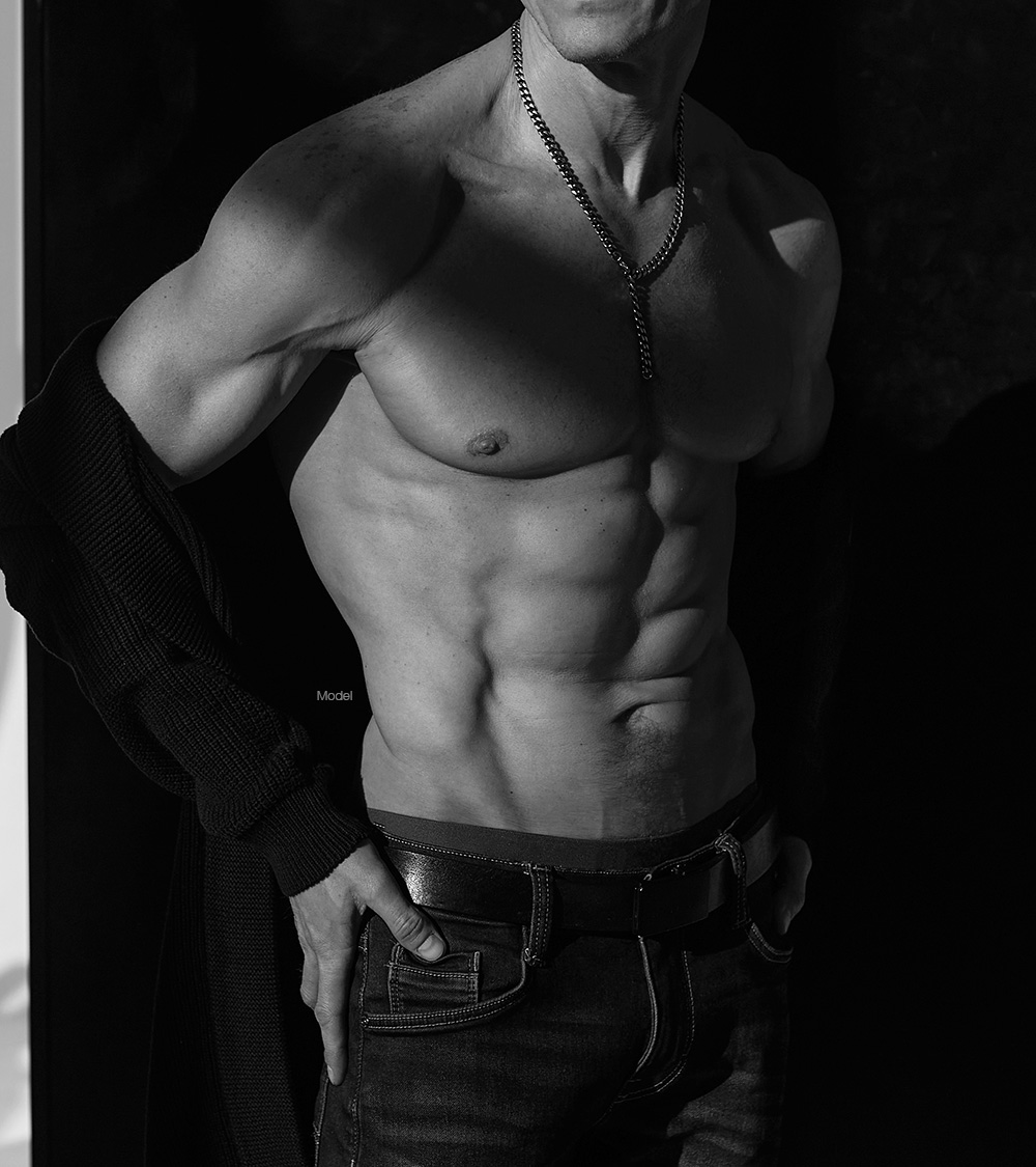 Fit shirtless man with defined abs