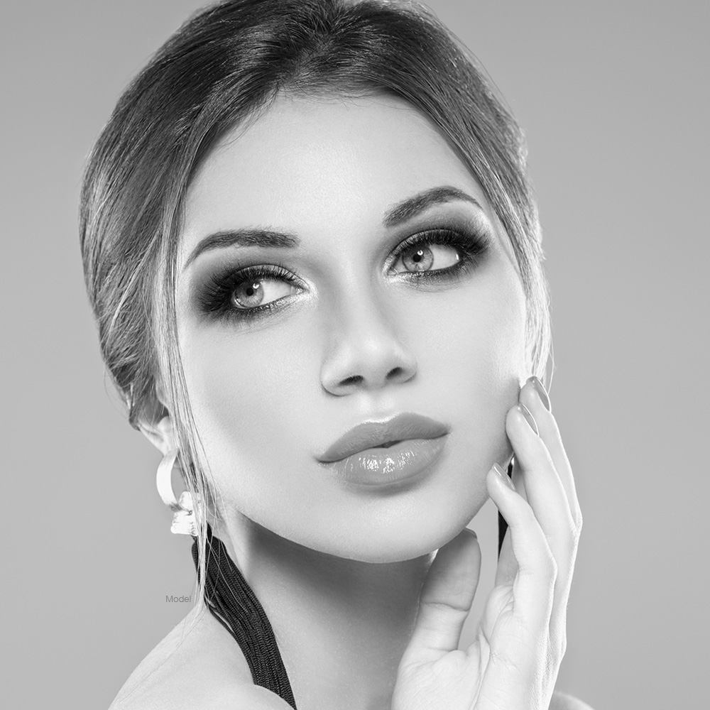 Beautiful woman touching her face